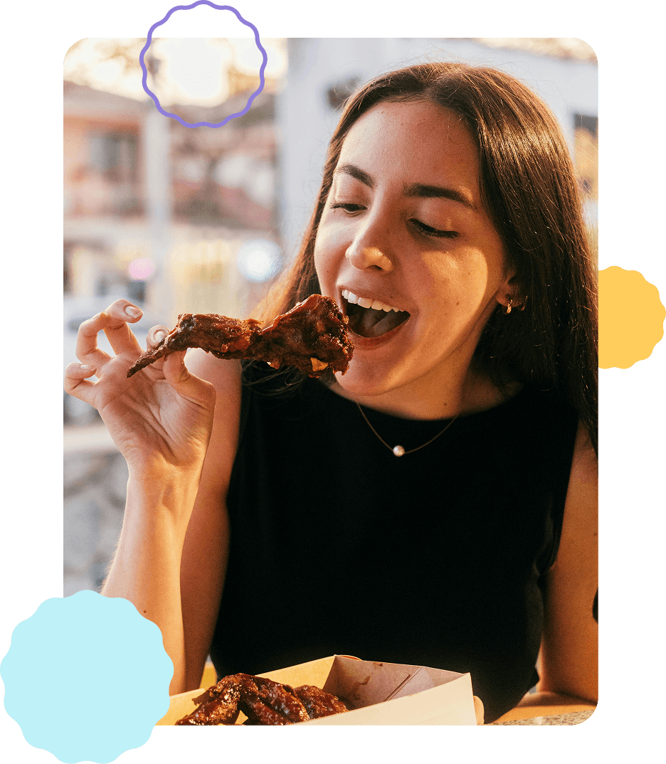 Woman happily eating at a local restaurant